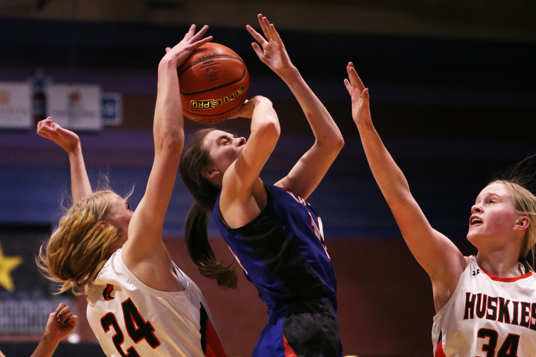 Karcee Maya shrugs down as the ball is pulled down and out of her hands